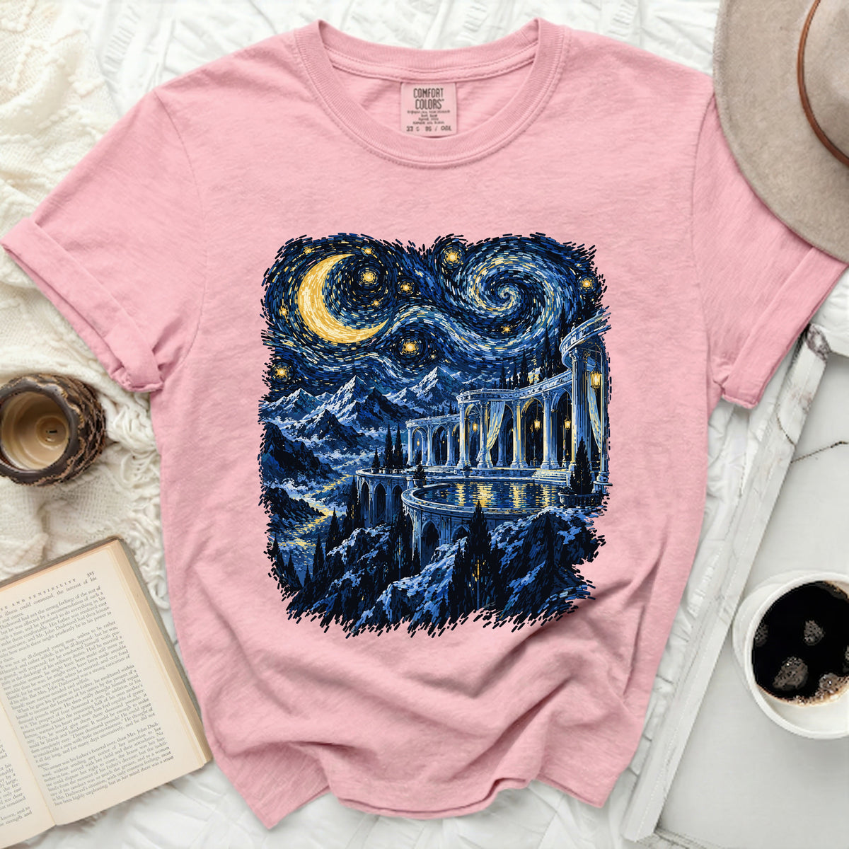 Pink t-shirt with a starry night castle landscape graphic and Comfort Colors tag.