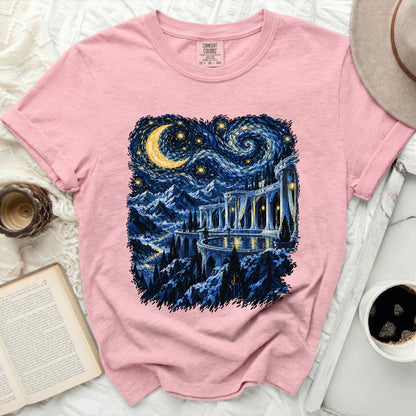 Pink t-shirt with a starry night castle landscape graphic and Comfort Colors tag.