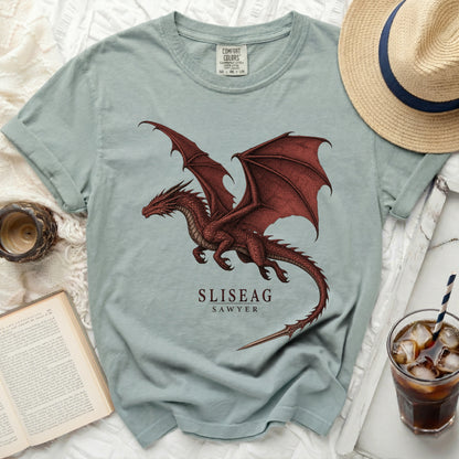 Light blue t-shirt with a red dragon graphic and "SLISEAG SAWYER" text.