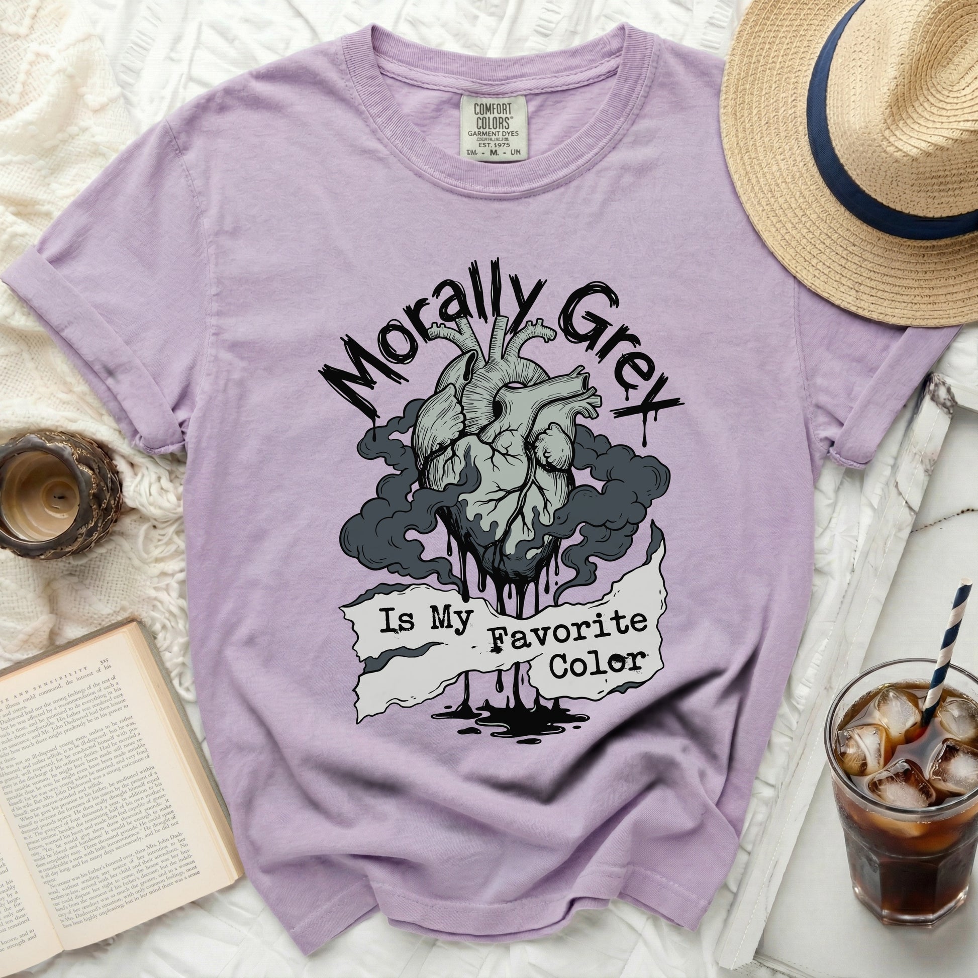 Purple t-shirt with graphic of a heart, smoke, and text "Morally Grey Is My Favorite Color".