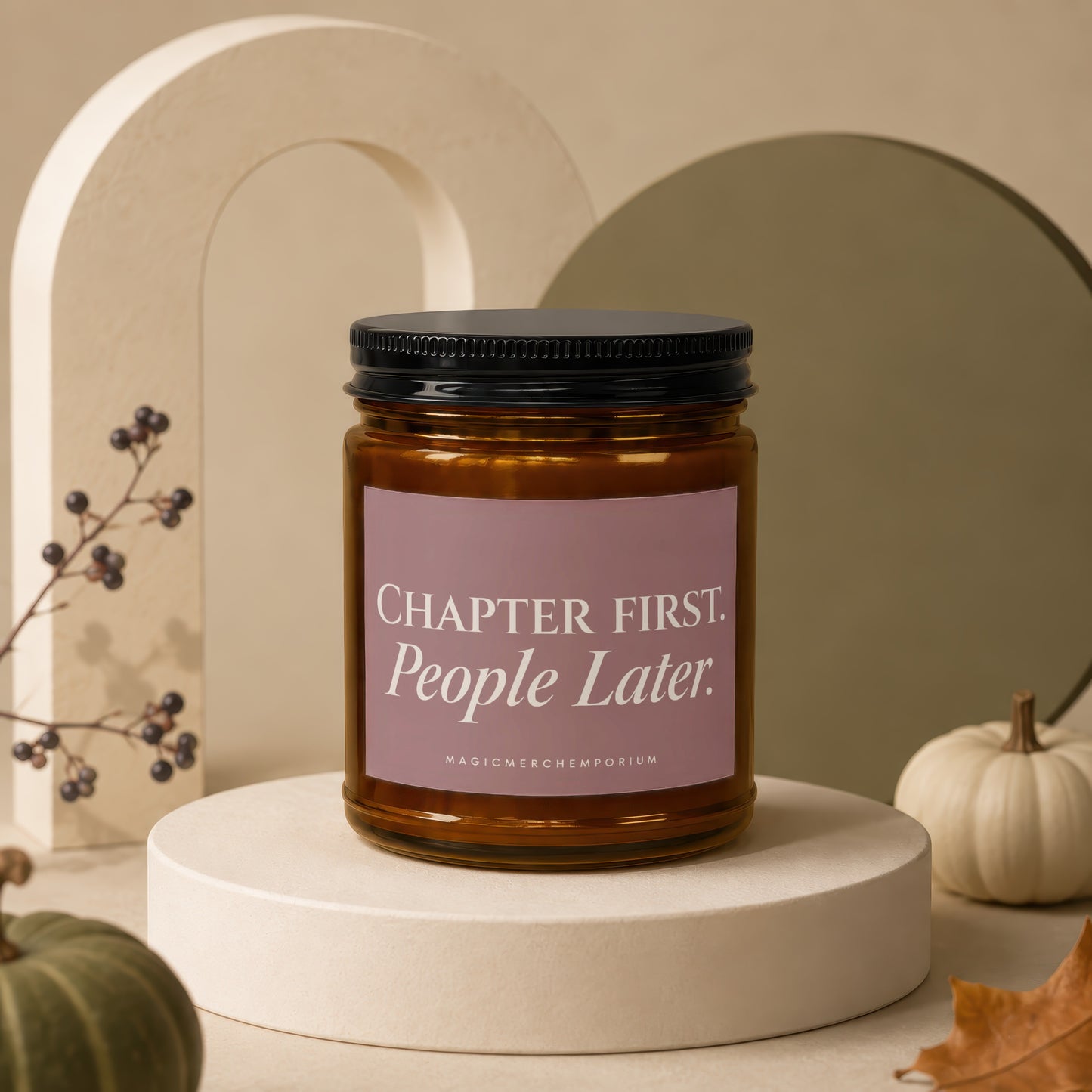Amber jar candle with pink label reading "CHAPTER FIRST. People Later."
