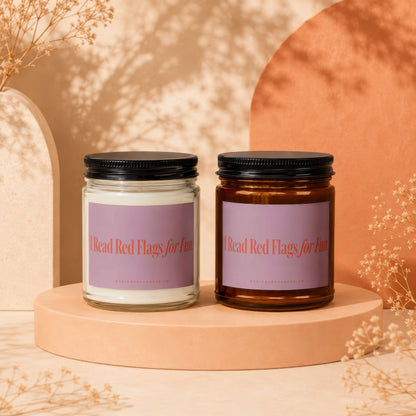 Two candles with labels that say "I Read Red Flags for Fun".