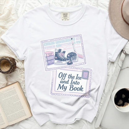 White t-shirt with "Off the Ice and Into My Book" graphic and hockey imagery.