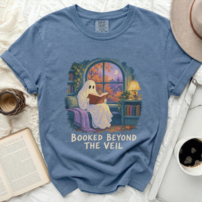 Ghost reading a book by a window with fall scenery, "Booked Beyond The Veil" text.