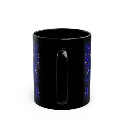 Black mug with decorative blue stained glass pattern on sides.