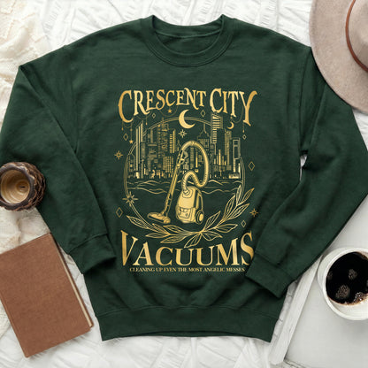 Green sweatshirt with gold text and graphics of a vacuum and city skyline.