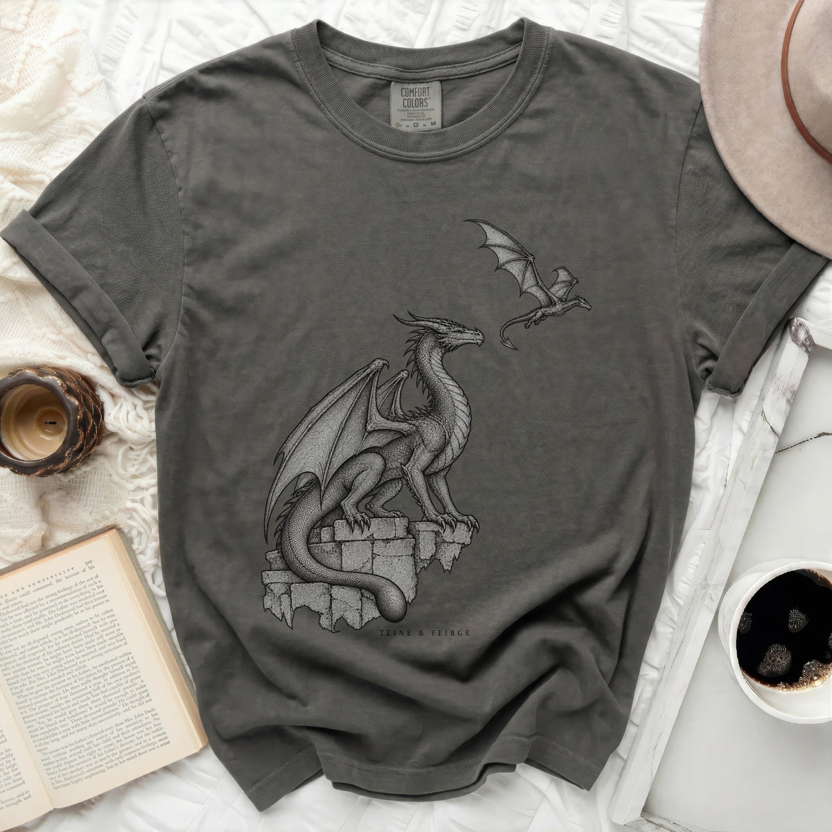 T-shirt with a gray dragon perched on ruins and a smaller dragon in flight.