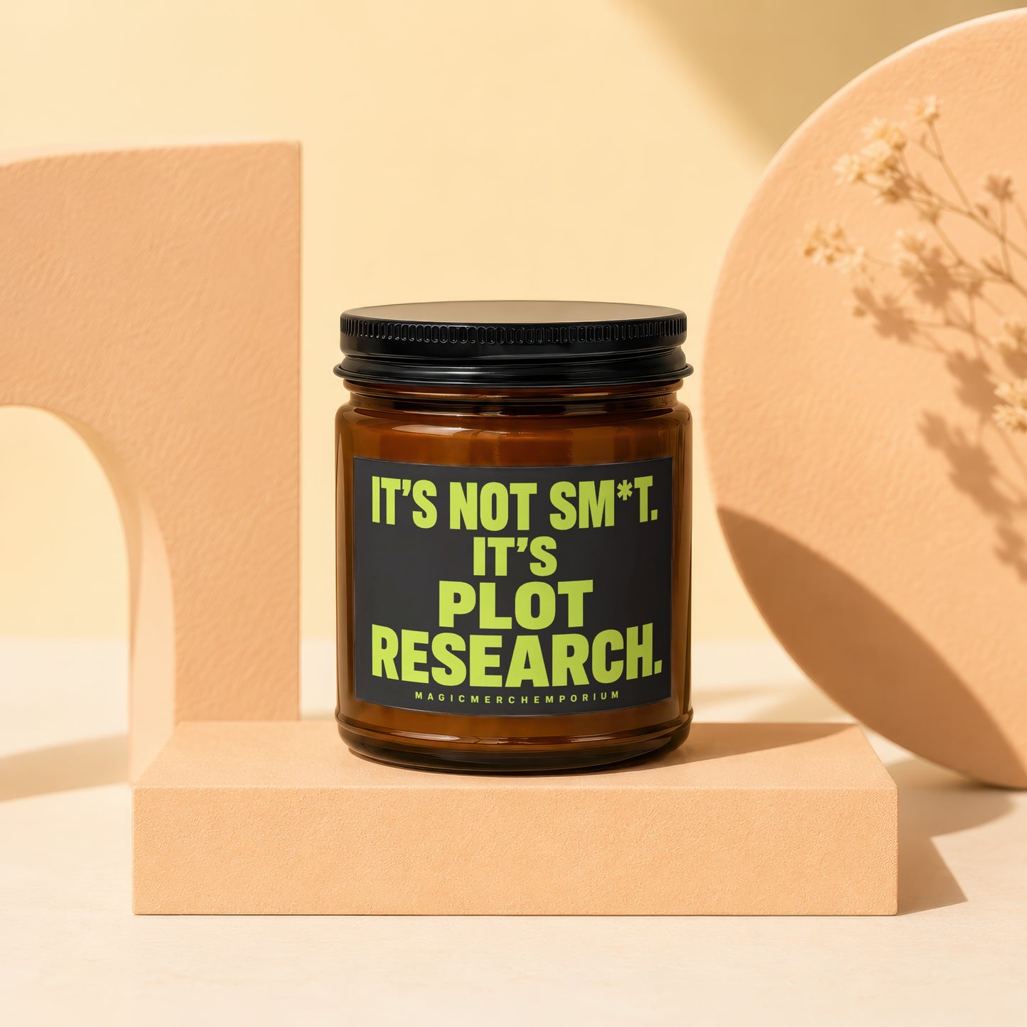 Amber candle with black lid features bright green text: "It's Not Sm*t. It's Plot Research."