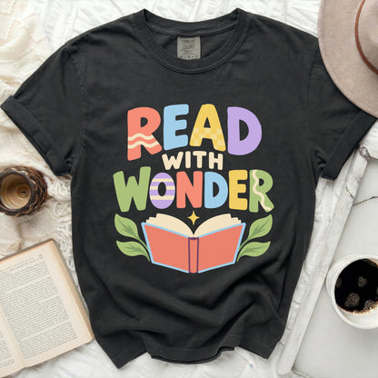 Black t-shirt with colorful "Read with Wonder" text and open book graphic.