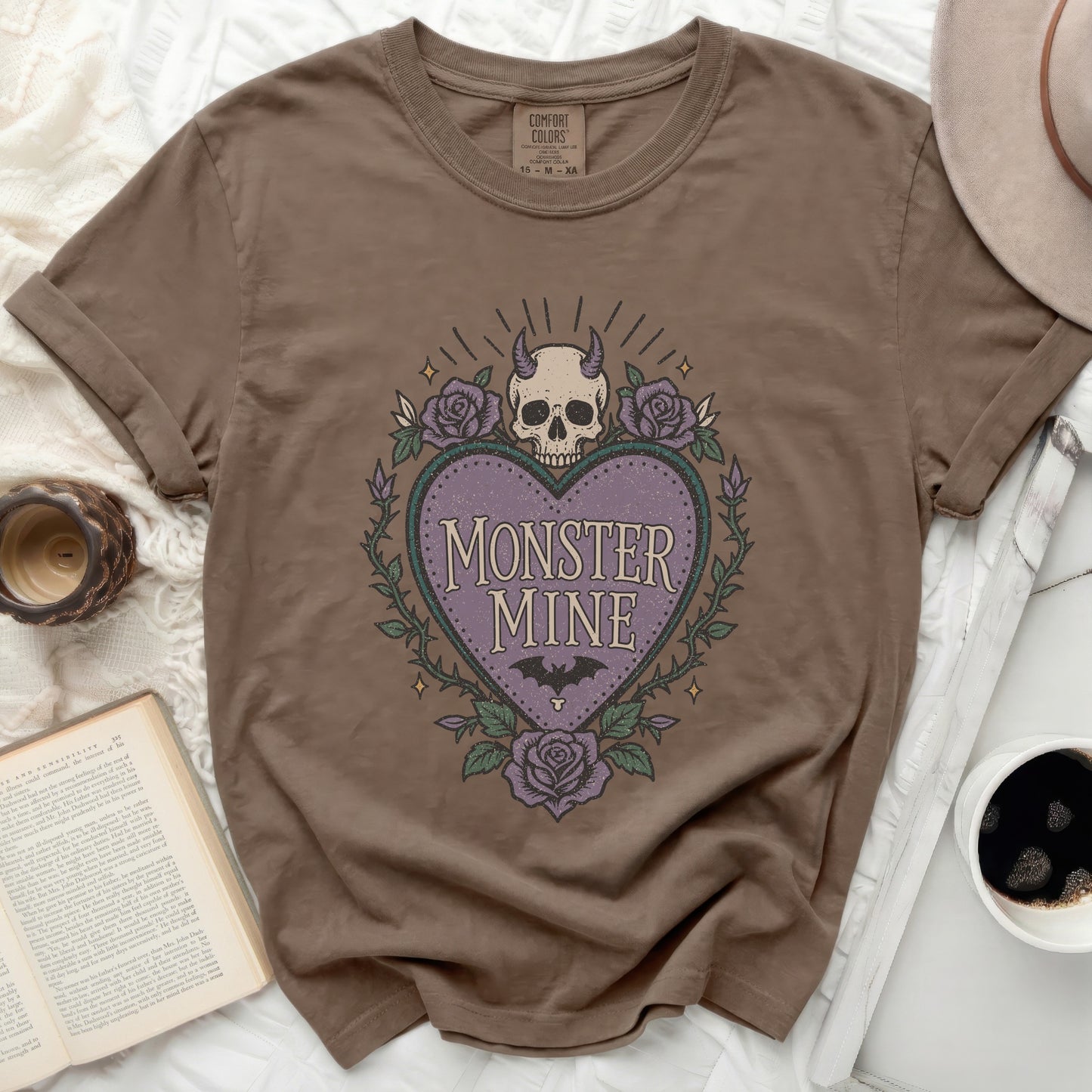 Brown t-shirt with "Monster Mine" heart graphic and purple roses.