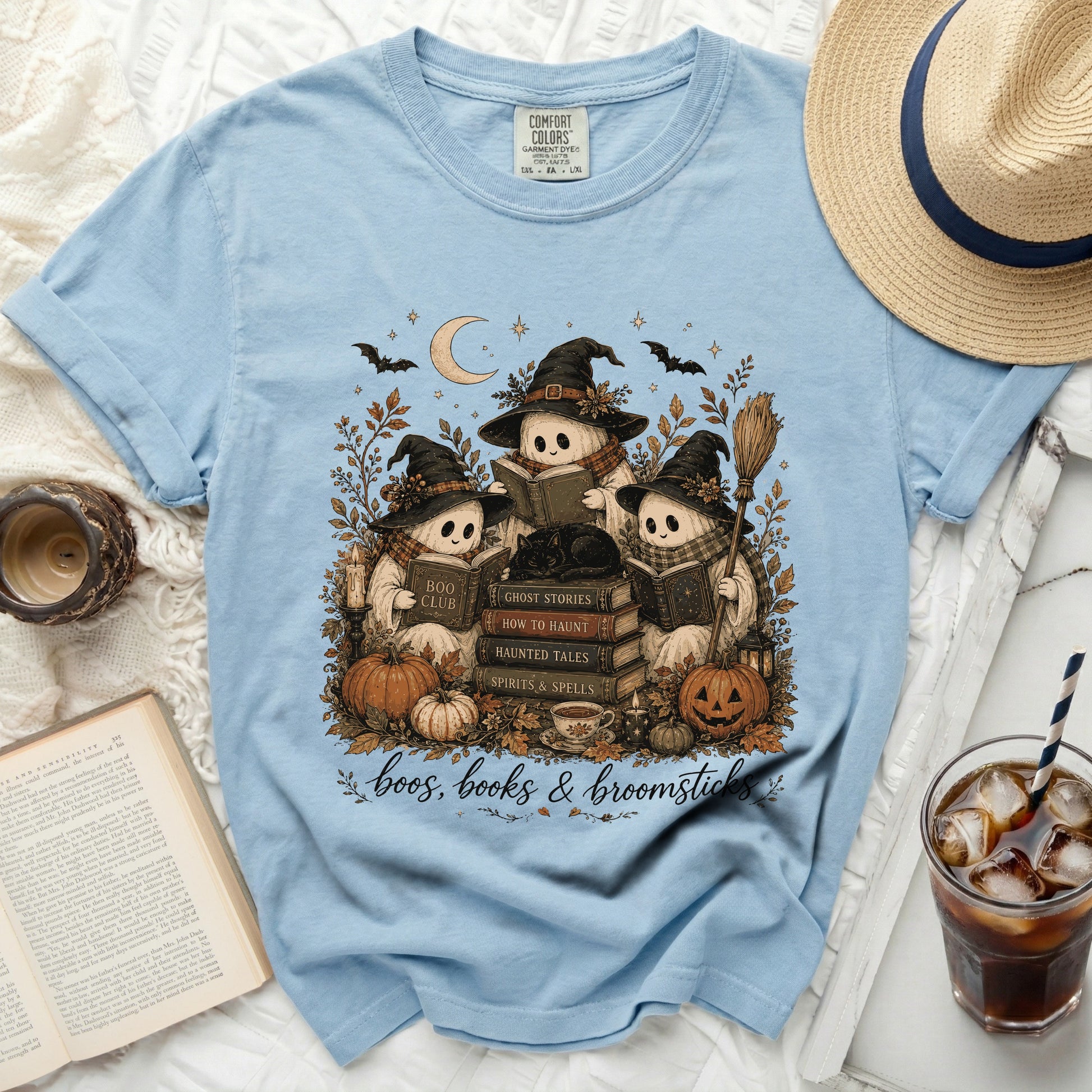 Three ghosts wearing witch hats reading books with Halloween-themed text.
