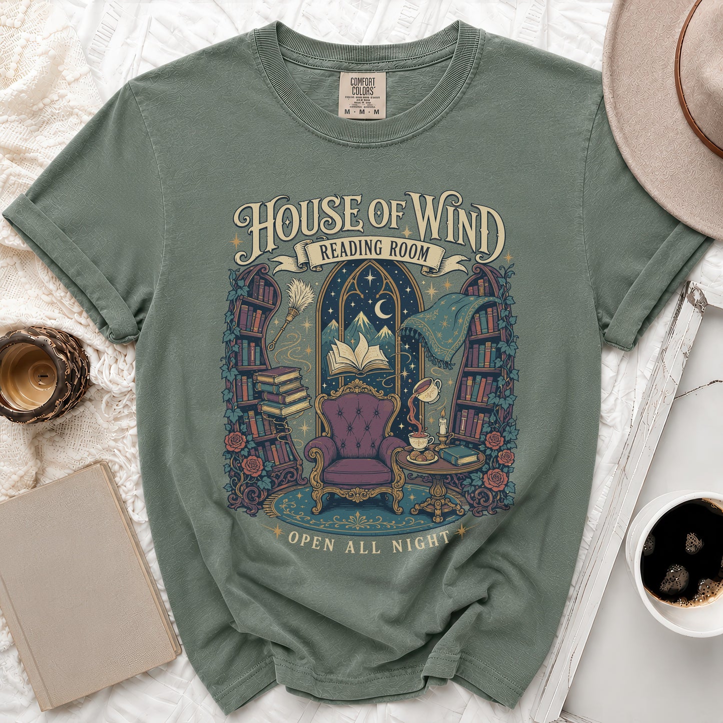 Green t-shirt with "House of Wind Reading Room Open All Night" graphic.