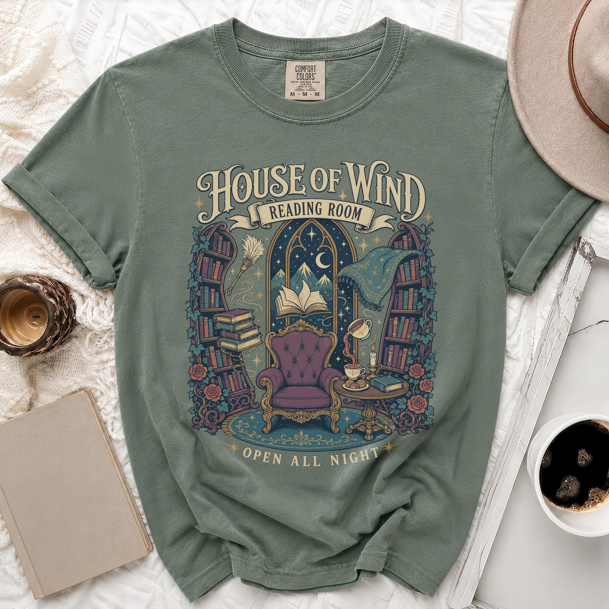 Green t-shirt with "House of Wind Reading Room Open All Night" graphic.