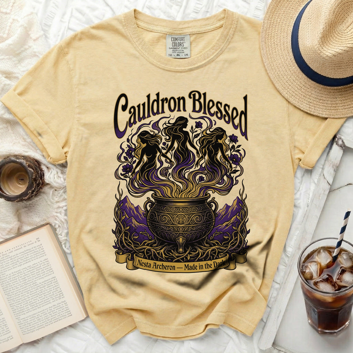 Yellow t-shirt with "Cauldron Blessed" and witches graphic; "Nesta Archeron" text.