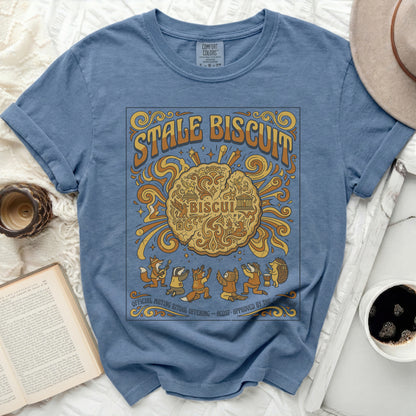 Blue t-shirt with "Stale Biscuit" graphic featuring cartoon animals and a biscuit.
