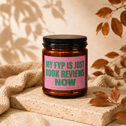 Amber candle with pink label reading "MY FYP IS JUST BOOK REVIEWS NOW".