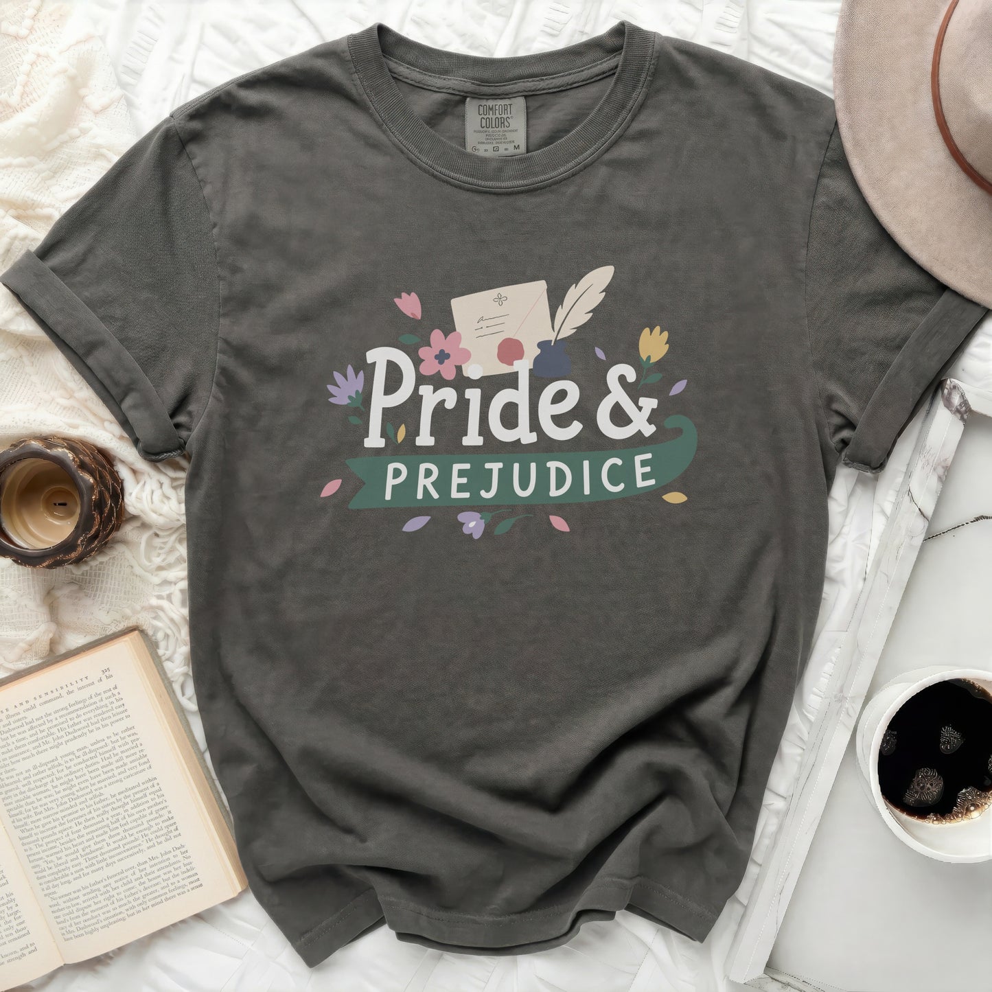 Gray t-shirt with "Pride & Prejudice" text and floral graphic.