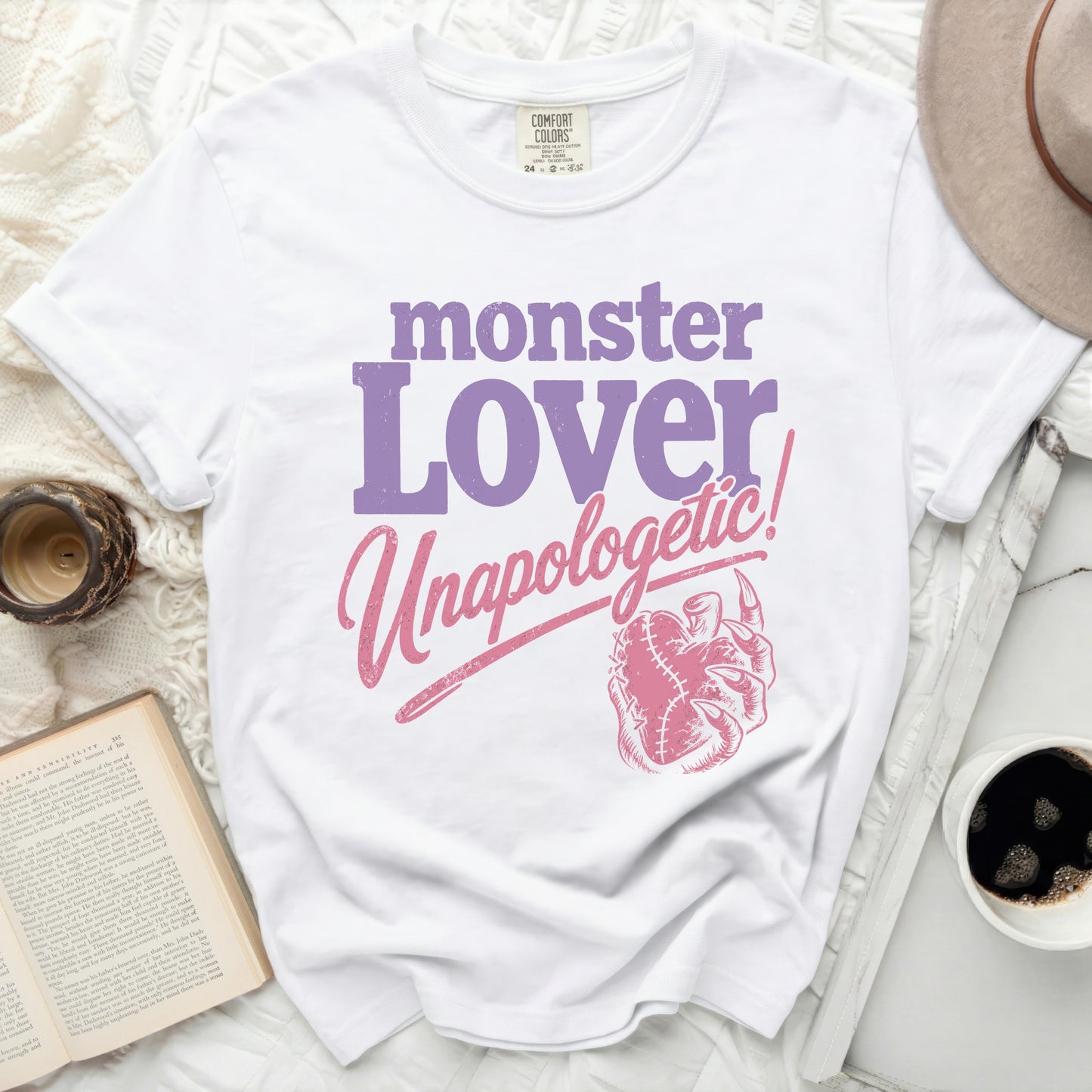 White t-shirt with "monster Lover Unapologetic!" in purple and pink text.