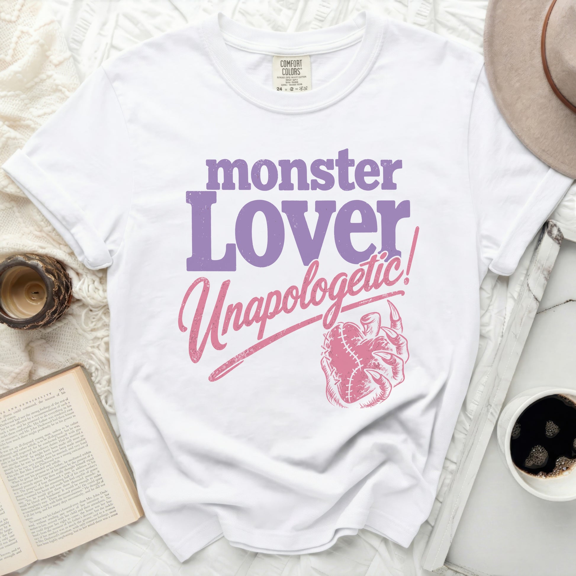 White t-shirt with "monster Lover Unapologetic!" in purple and pink text.