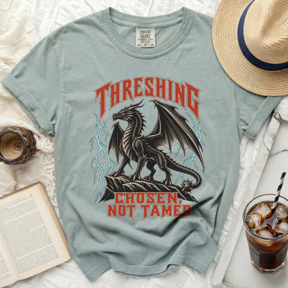 Gray t-shirt with a black dragon graphic and text "THRESHING CHOSEN, NOT TAMED."