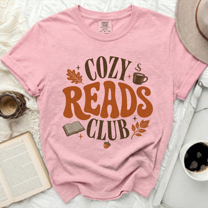 Pink t-shirt with "COZY READS CLUB" text, book, and fall leaves.