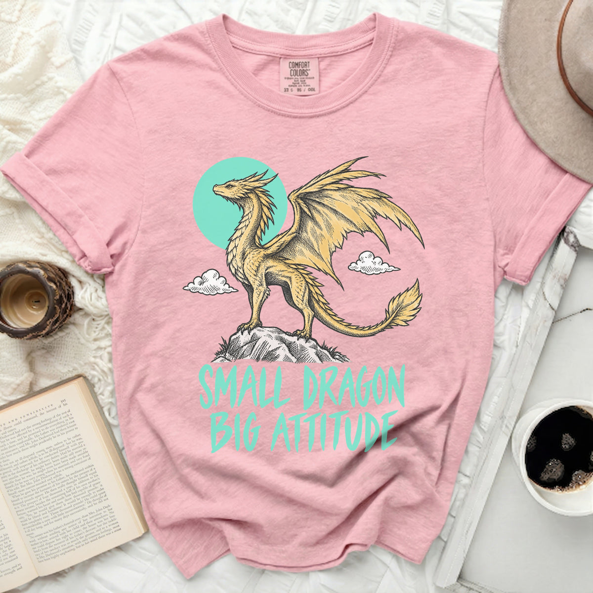 Pink t-shirt with a golden dragon graphic and "SMALL DRAGON BIG ATTITUDE" text.
