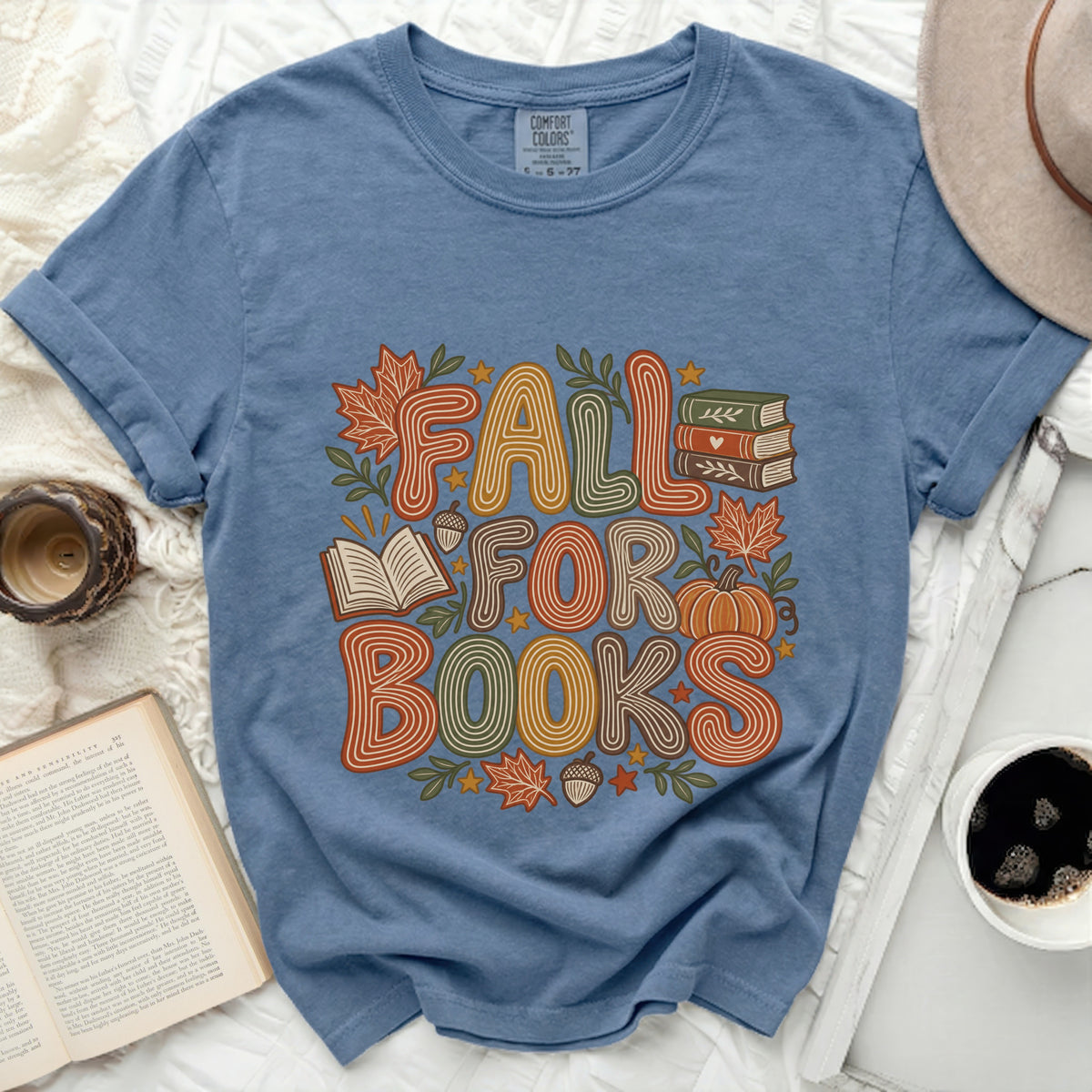 Blue t-shirt with "Fall For Books" graphic, featuring pumpkins and books.