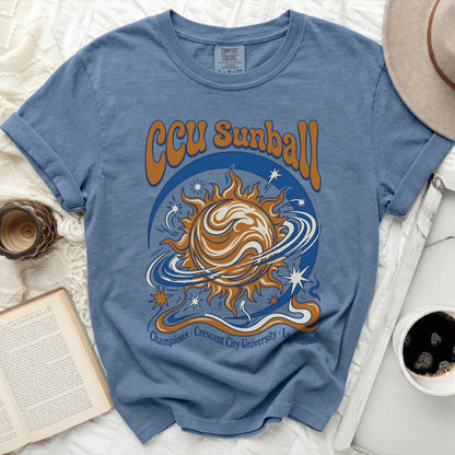 Blue t-shirt with "CCU Sunball Champions Crescent City University" text and sun graphic.