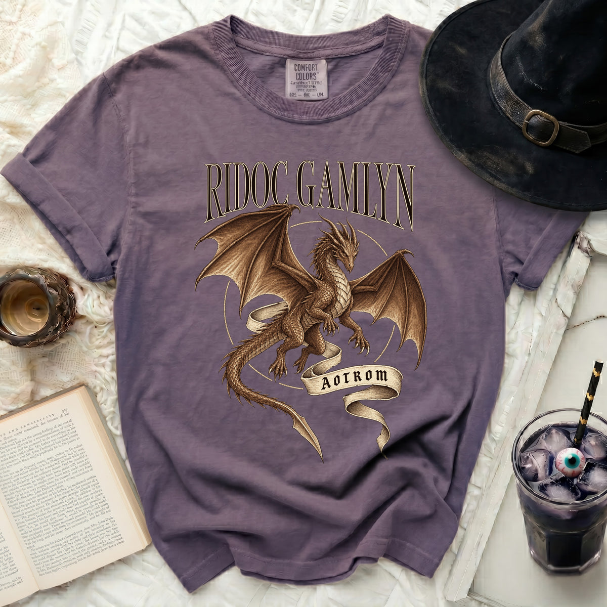 Purple t-shirt with "RIDOC GAMLYN" and a dragon graphic with "AOTROM".