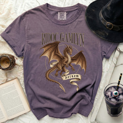 Purple t-shirt with "RIDOC GAMLYN" and a dragon graphic with "AOTROM".