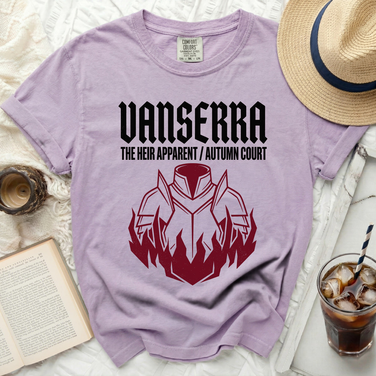 Lavender t-shirt with black text "VANSERRA THE HEIR APPARENT / AUTUMN COURT" and maroon armor graphic.