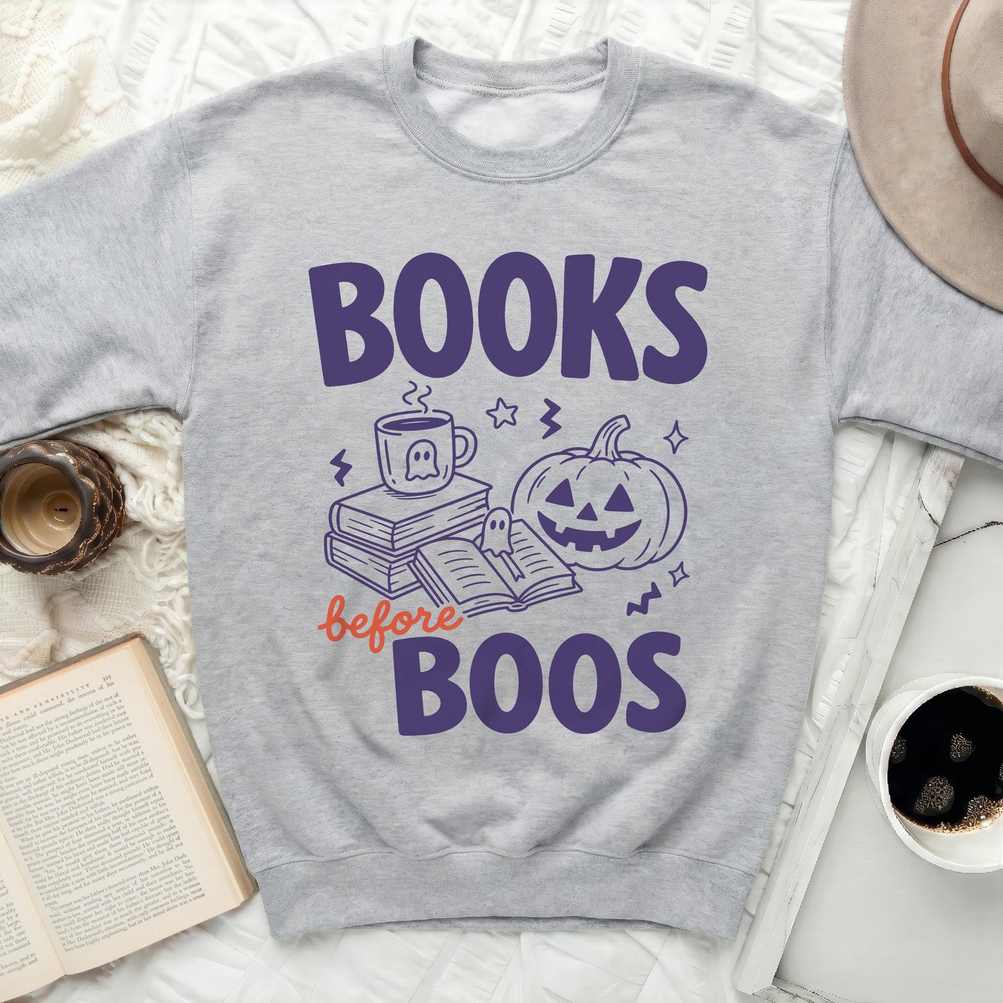 Gray crewneck sweatshirt with "Books before Boos" Halloween graphic.