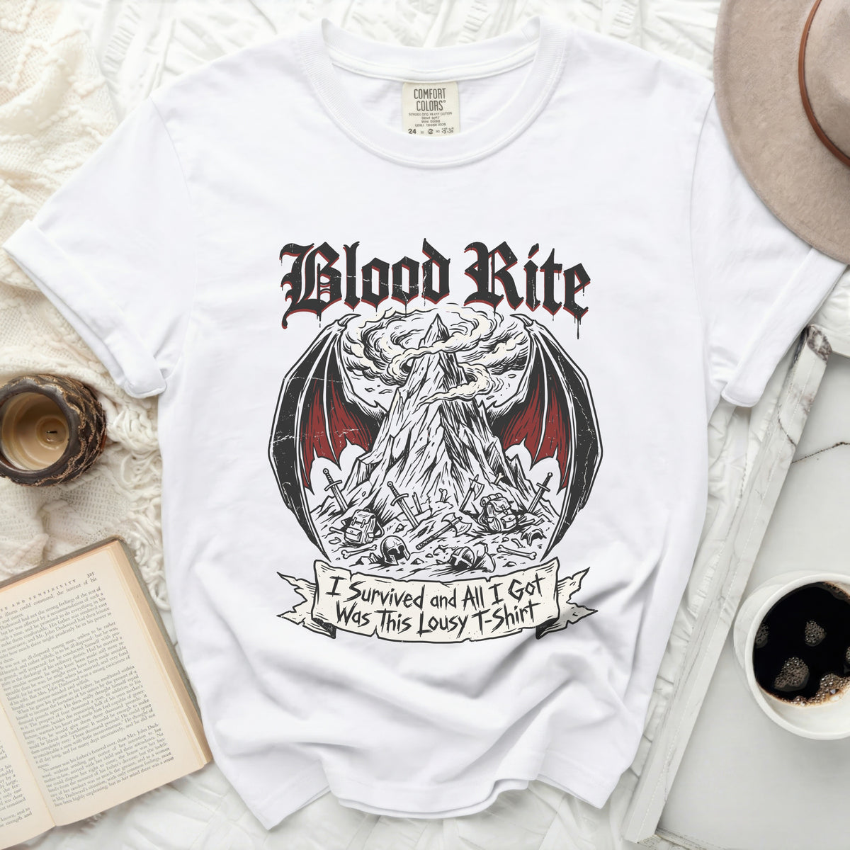 White t-shirt with "Blood Rite" graphic and "I Survived and All I Got Was This Lousy T-Shirt" text.