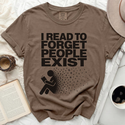 Brown t-shirt with "I READ TO FORGET PEOPLE EXIST" text and stylized graphic.