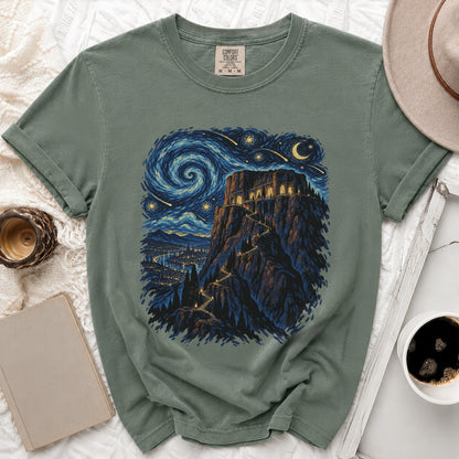 Green t-shirt with a castle on a mountain under a starry night sky.