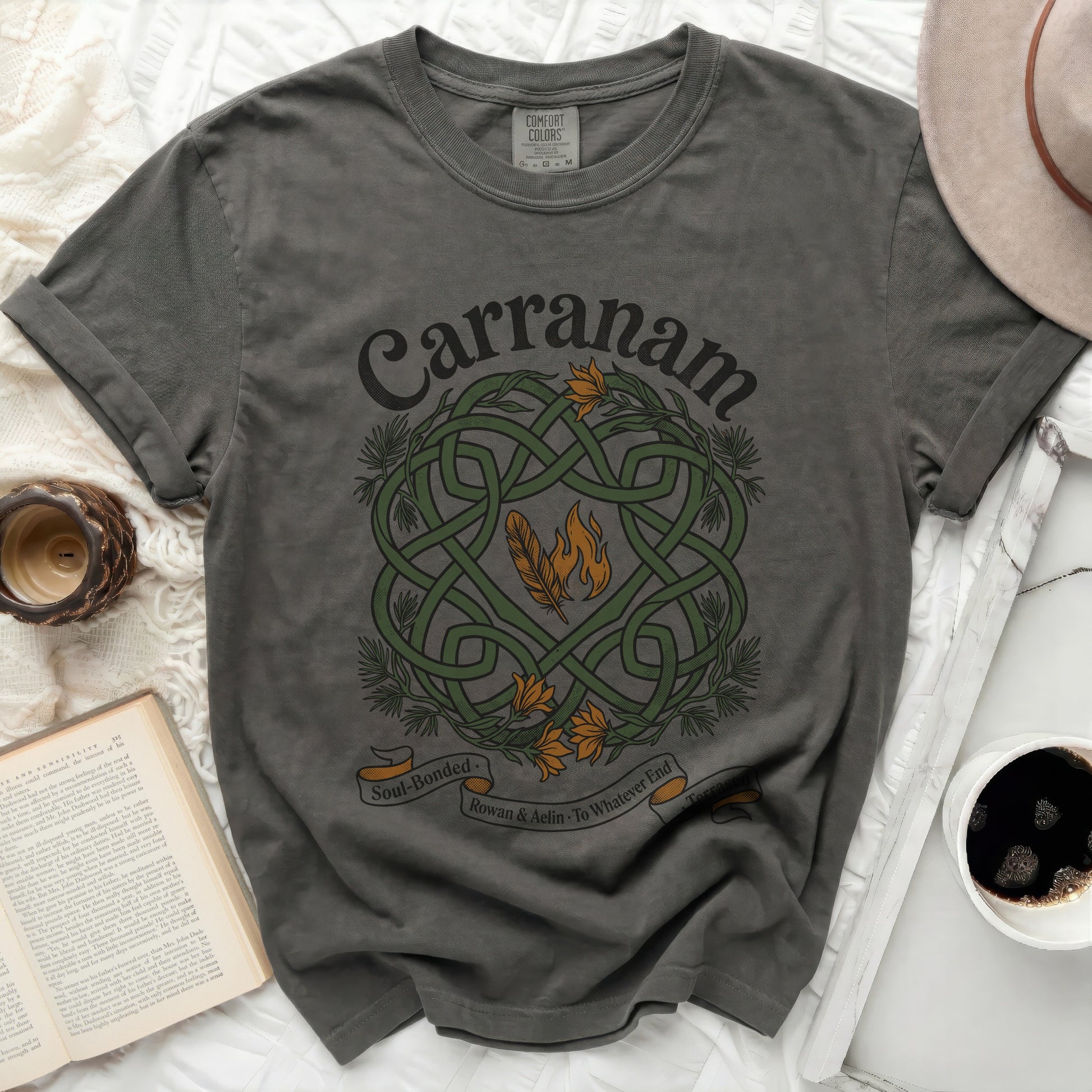 Dark gray t-shirt with green Celtic knot, feathers, and flames design.