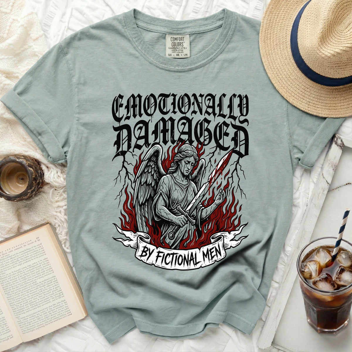 T-shirt with angel graphic and text "Emotionally Damaged By Fictional Men".