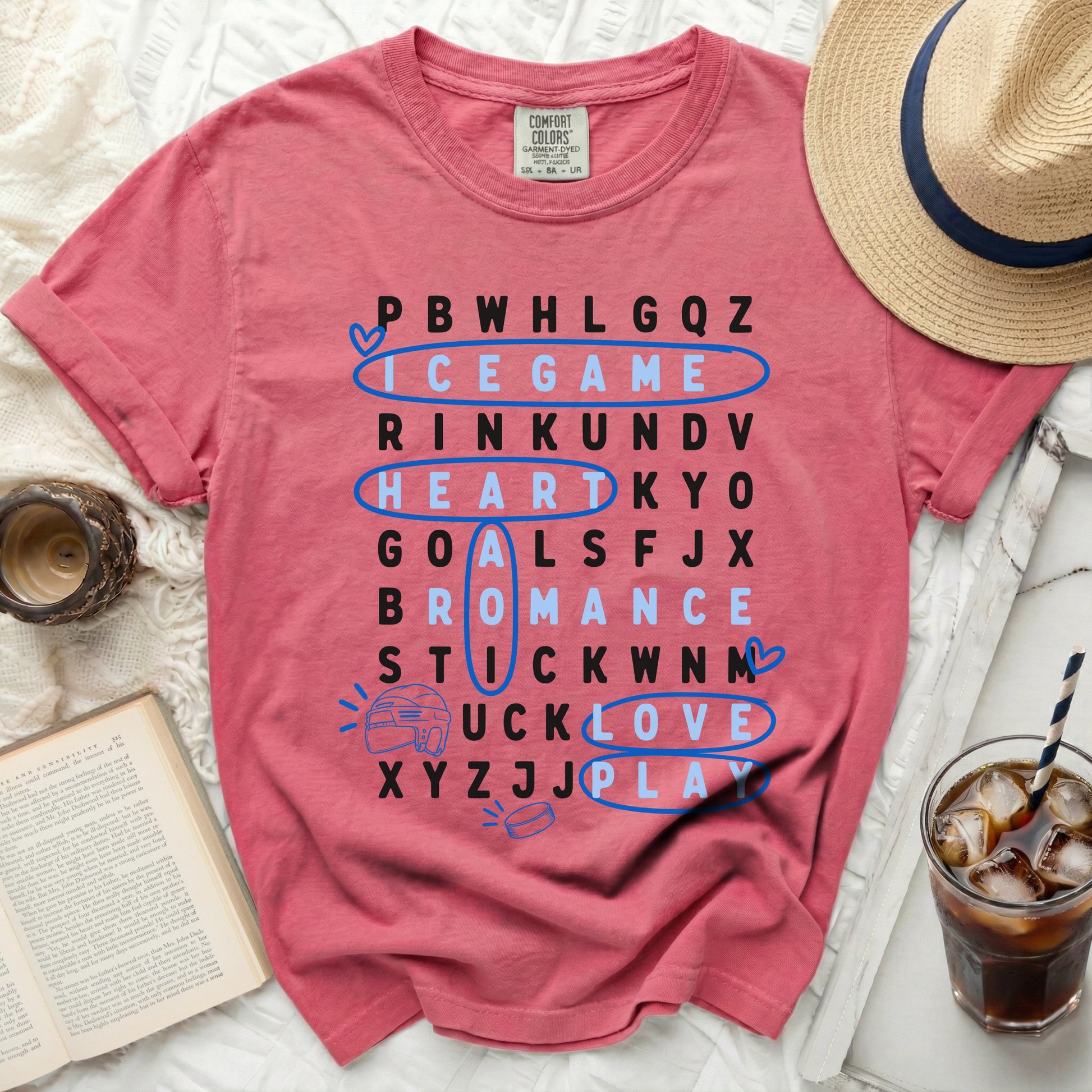 Pink t-shirt with word search game: ICE GAME, HEART, GOALS, PLAY