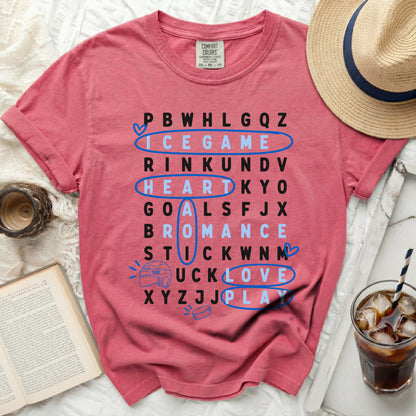 Pink t-shirt with word search game: ICE GAME, HEART, GOALS, PLAY