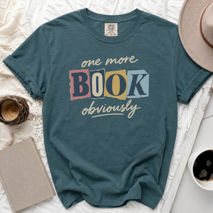T-shirt with "one more BOOK obviously" graphic.