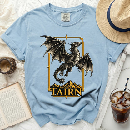 Light blue t-shirt with a black dragon graphic and "TAIRN" text.