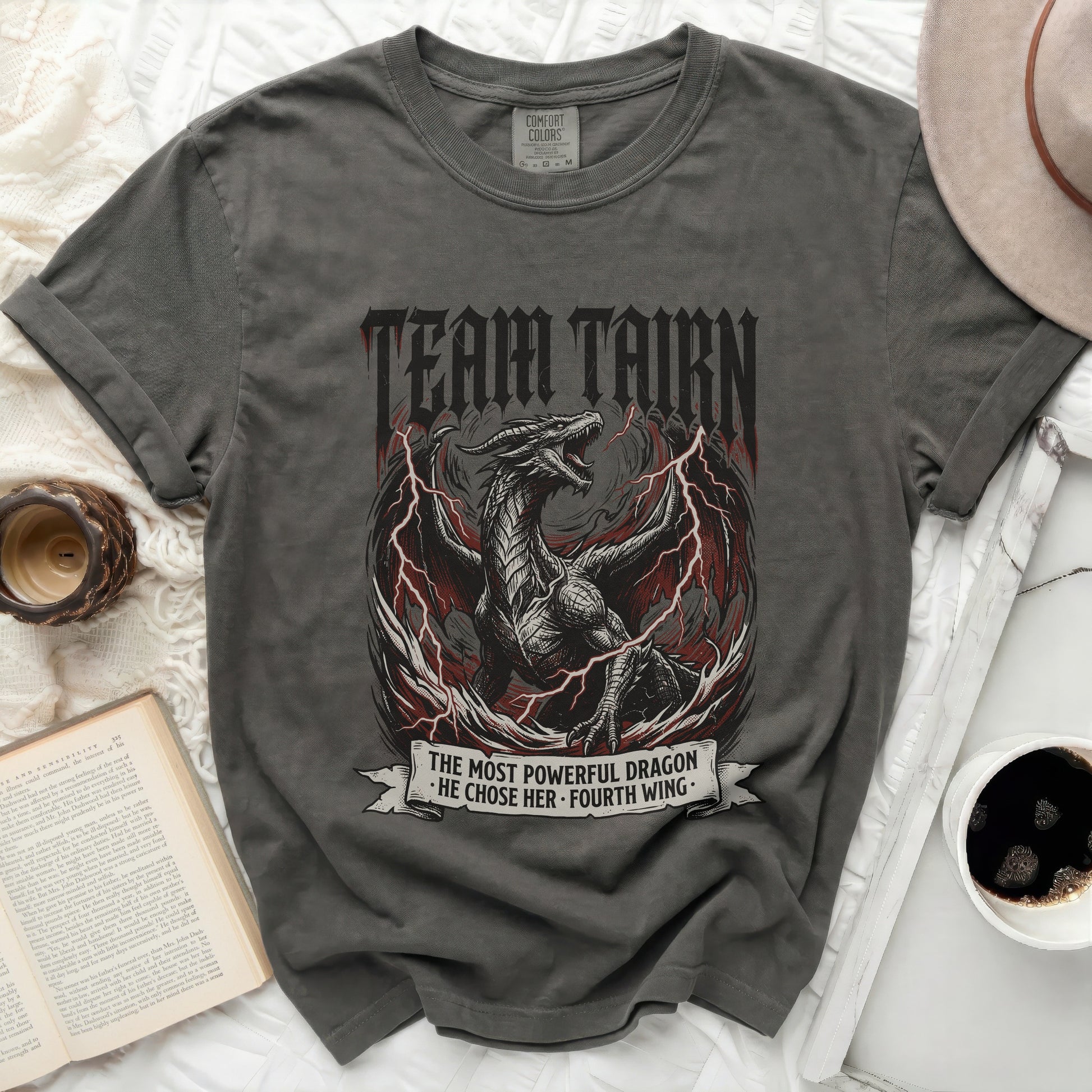 Dark grey t-shirt with a dragon graphic and text "TEAM TAIRN THE MOST POWERFUL DRAGON HE CHOSE HER. FOURTH WING."
