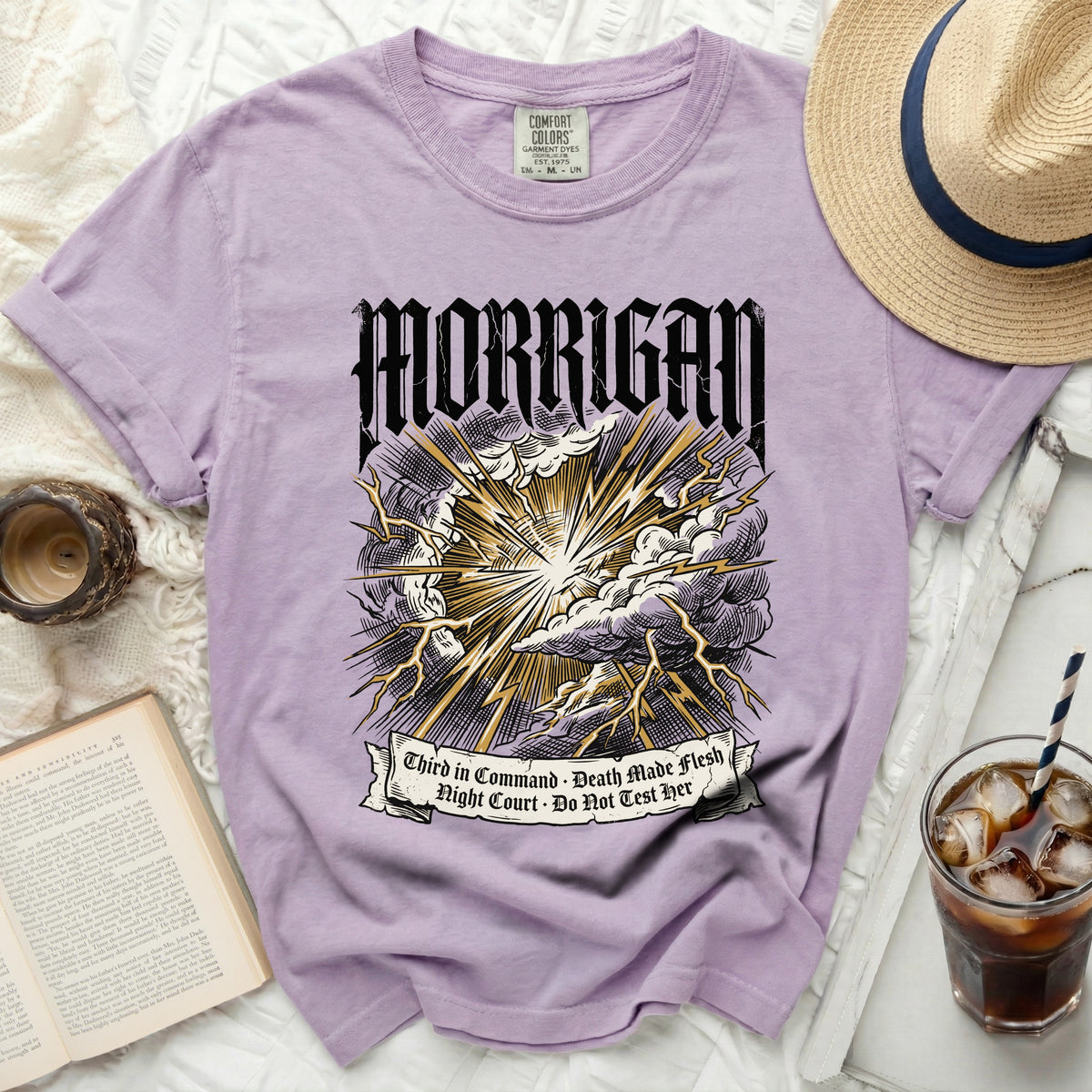 Purple t-shirt with Morrigan lightning graphic and text.