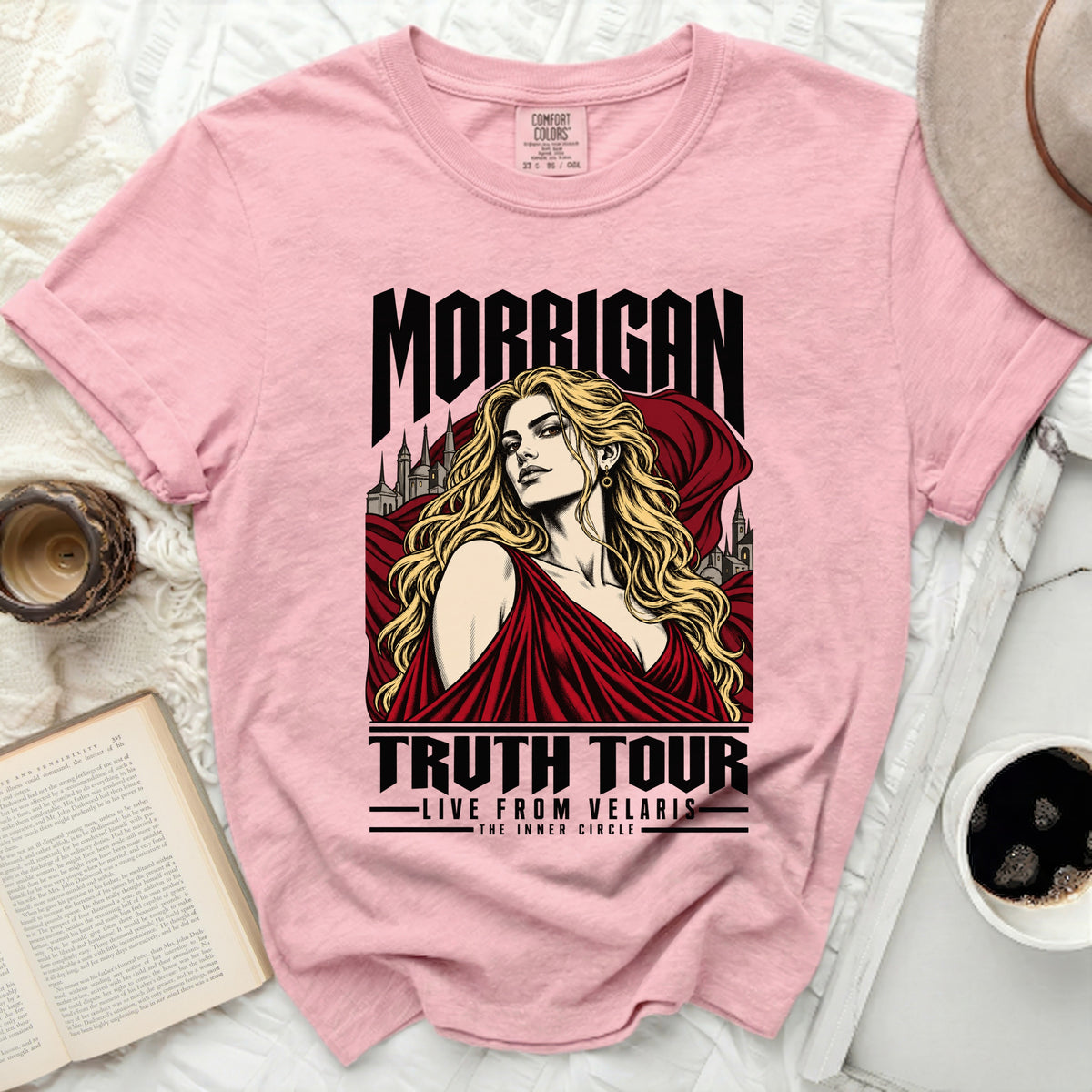 Pink t-shirt with graphic of "Morrigan Truth Tour Live from Velaris The Inner Circle."