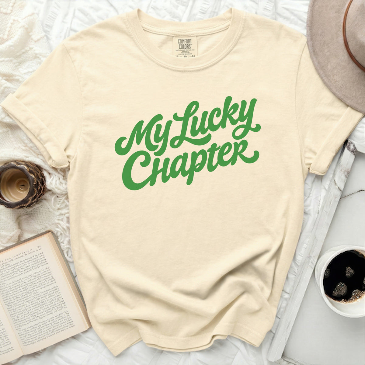 Cream t-shirt with green text "My Lucky Chapter"