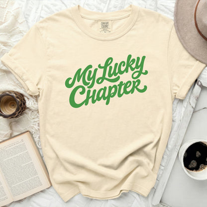 Cream t-shirt with green text "My Lucky Chapter"