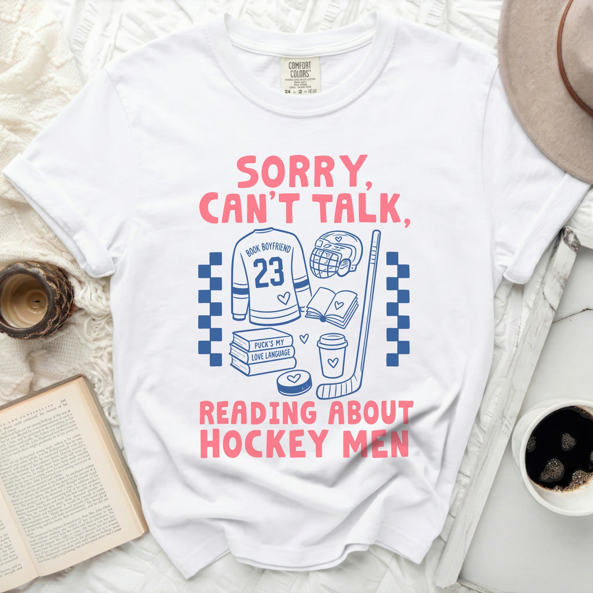 T-shirt with "Sorry, Can't Talk, Reading About Hockey Men" text.