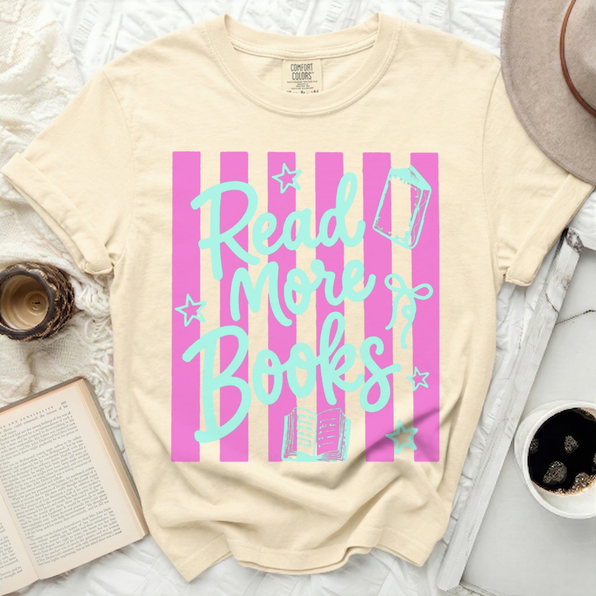 Beige t-shirt with pink stripes and "Read More Books" text.