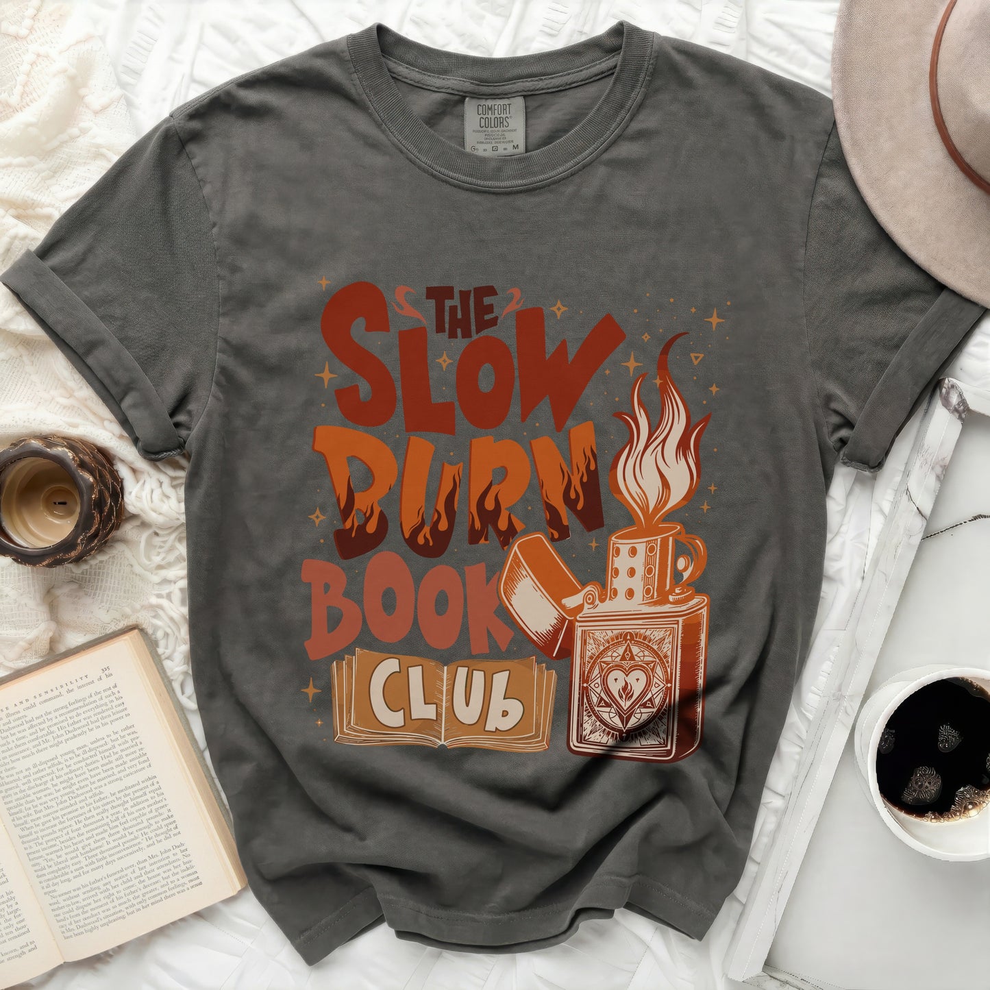 The Slow Burn Book Club graphic tee with a lighter and books.