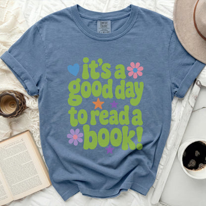 Blue t-shirt with "it's a good day to read a book!" graphic.